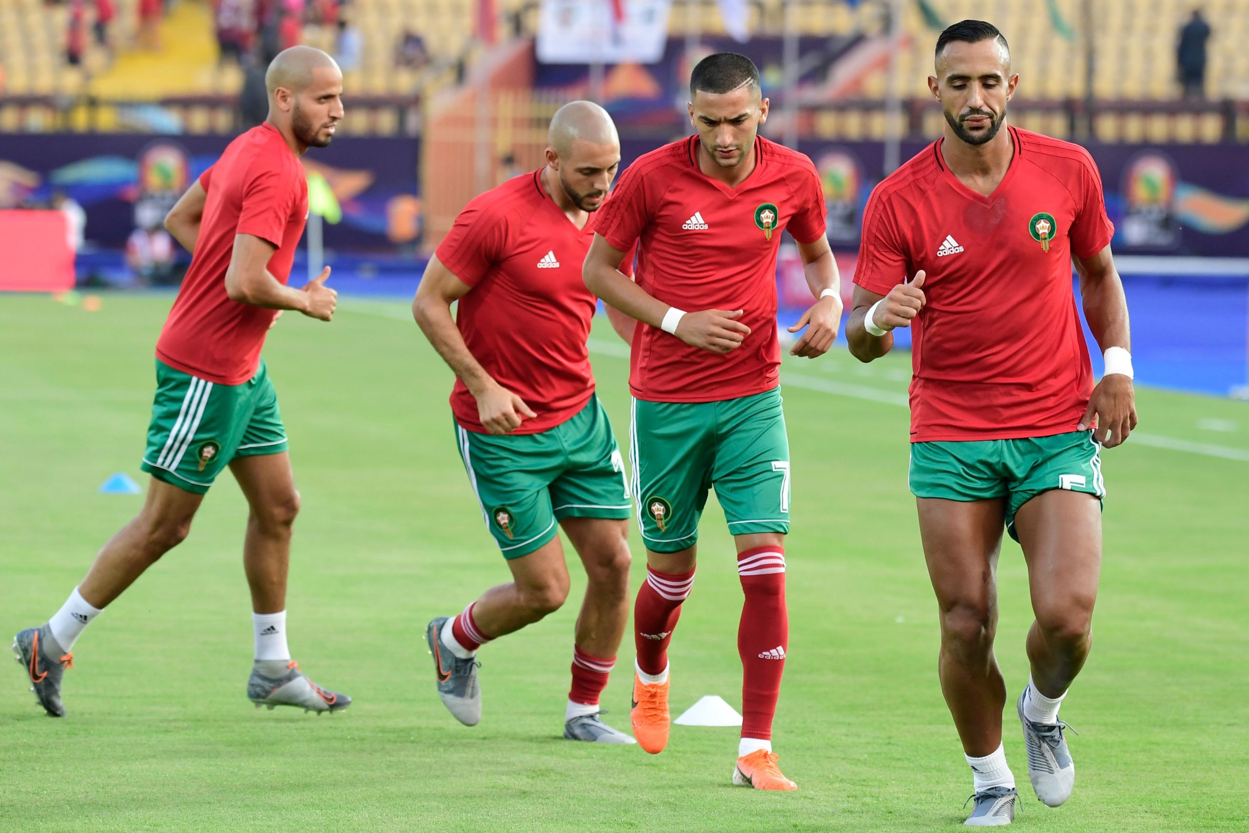 Morocco's defender Medhi Benatia (R) and Morocco's forward Hakim Ziyech (2nd-R) warm up ahead of the 2019 Africa Cup of Nations (CAN) Group D football match between Morocco and Ivory Coast at the Al Salam Stadium in the Egyptian capital Cairo on June 28, 2019. (Photo by JAVIER SORIANO / AFP) (Photo credit should read JAVIER SORIANO/AFP via Getty Images)