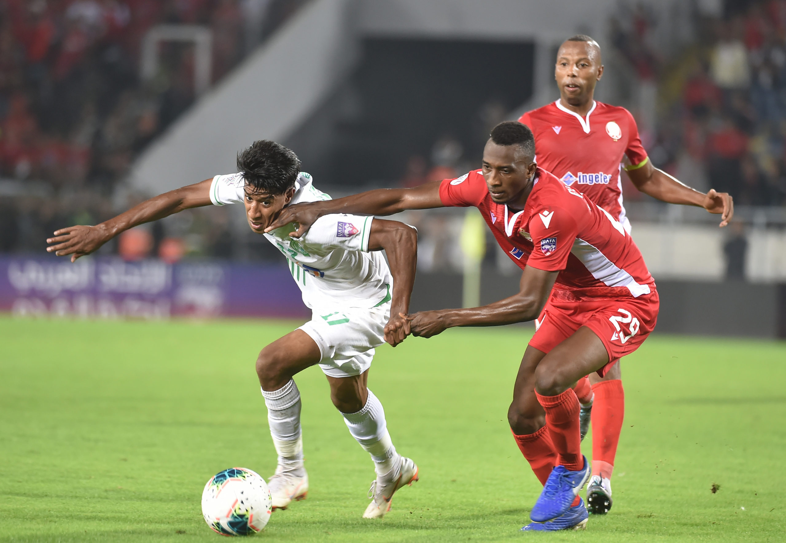 Wydad's Cheikh Ibrahim Komara (R) vies with Raja's Hamid Ahdad during the Mohammed VI Champion cup match between Morocco's Wydad Athletic Club and Morocco's Raja Club Atletic on November 2, 2019 in Casablanca. (Photo by STR / AFP) (Photo by STR/AFP via Getty Images)