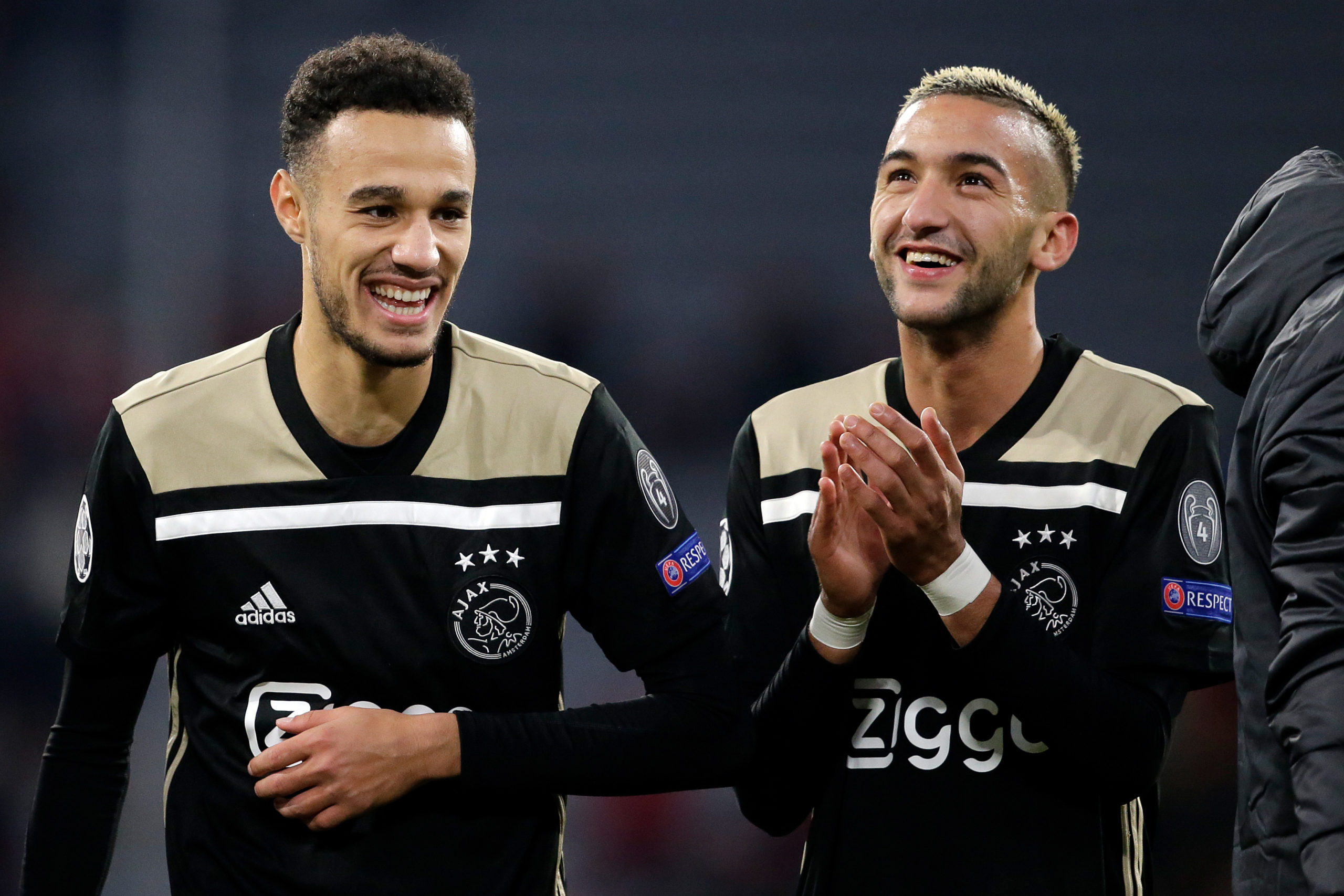 MUNICH, GERMANY - OCTOBER 2: (L-R) Hakim Ziyech of Ajax, Noussair Mazraoui of Ajax celebrates the victory during the UEFA Champions League match between Bayern Munchen v Ajax at the Allianz Arena on October 2, 2018 in Munich Germany (Photo by Erwin Spek/Soccrates/Getty Images)