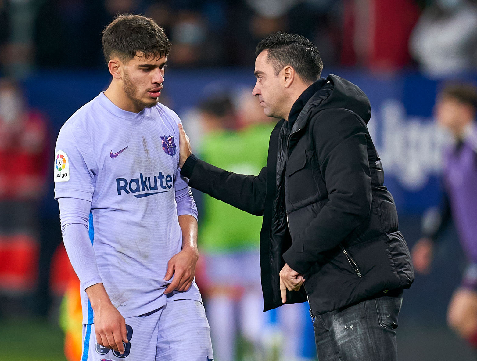 PAMPLONA, SPAIN - DECEMBER 12: Xavi Hernandez, Manager of FC Barcelona gives instructions to Abdessamad Ezzalzouli during the La Liga Santander match between CA Osasuna and FC Barcelona at Estadio El Sadar on December 12, 2021 in Pamplona, Spain. (Photo by Quality Sport Images/Getty Images)