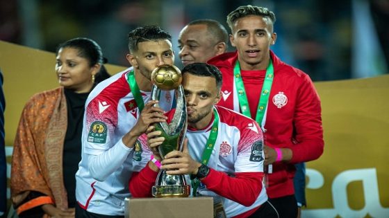 CASABLANCA, MOROCCO - MAY 30: Hamza Asrir, Mohamed Rahim and Taha Mourid of Wydad AC celebrates following their sides victory during the CAF Champions League Final 2022 match between Al Ahly and Wydad AC at Stade Mohammed V on May 30, 2022 in Casablanca, Morocco. (Photo by Sebastian Frej/MB Media/Getty Images)