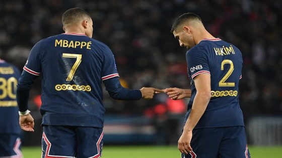 Paris Saint-Germain's French forward Kylian Mbappe (L) celebrates with Paris Saint-Germain's Moroccan defender Achraf Hakimi after scoring a goal during the French L1 football match between Paris Saint-Germain (PSG) and AS Monaco (ASM) at the Parc des Princes stadium in Paris, on December 12, 2021. (Photo by FRANCK FIFE / AFP) (Photo by FRANCK FIFE/AFP via Getty Images)