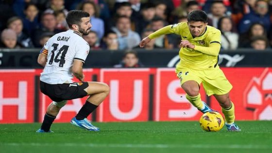 VALENCIA, SPAIN - JANUARY 02: Ilias Akhomach of Villarreal CF being followed by Jose Luis Gaya of Valencia CF during the LaLiga EA Sports match between Valencia CF and Villarreal CF at Estadio Mestalla on January 02, 2024 in Valencia, Spain. (Photo by Aitor Alcalde/Getty Images)