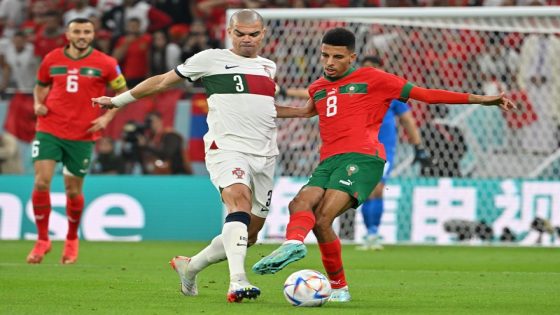 Portugal's defender #03 Pepe fights for the ball with Morocco's midfielder #08 Azzedine Ounahi during the Qatar 2022 World Cup quarter-final football match between Morocco and Portugal at the Al-Thumama Stadium in Doha on December 10, 2022. (Photo by Alberto PIZZOLI / AFP)