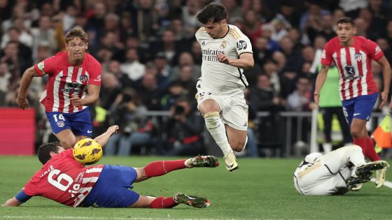 Atletico Madrid's Spanish midfielder #06 Koke fights for the ball with Real Madrid's Spanish forward #21 Brahim Diaz during the Spanish league football match between Real Madrid CF and Club Atletico de Madrid at the Santiago Bernabeu stadium in Madrid on February 4, 2024. (Photo by Thomas COEX / AFP)
